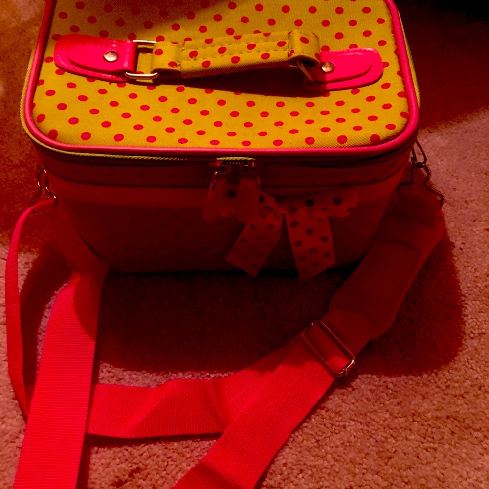 Great poker dot and pink cosmetics bag .